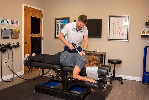 Chiropractor Swansea IL Dr. Jonathan Currier Adjusting Patient